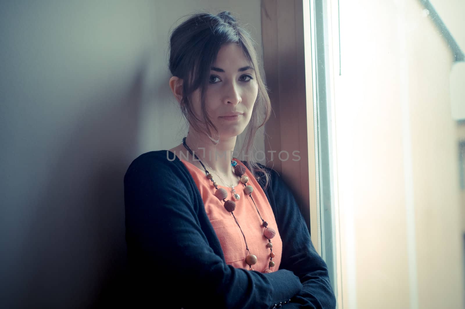 beautiful woman at home near window
