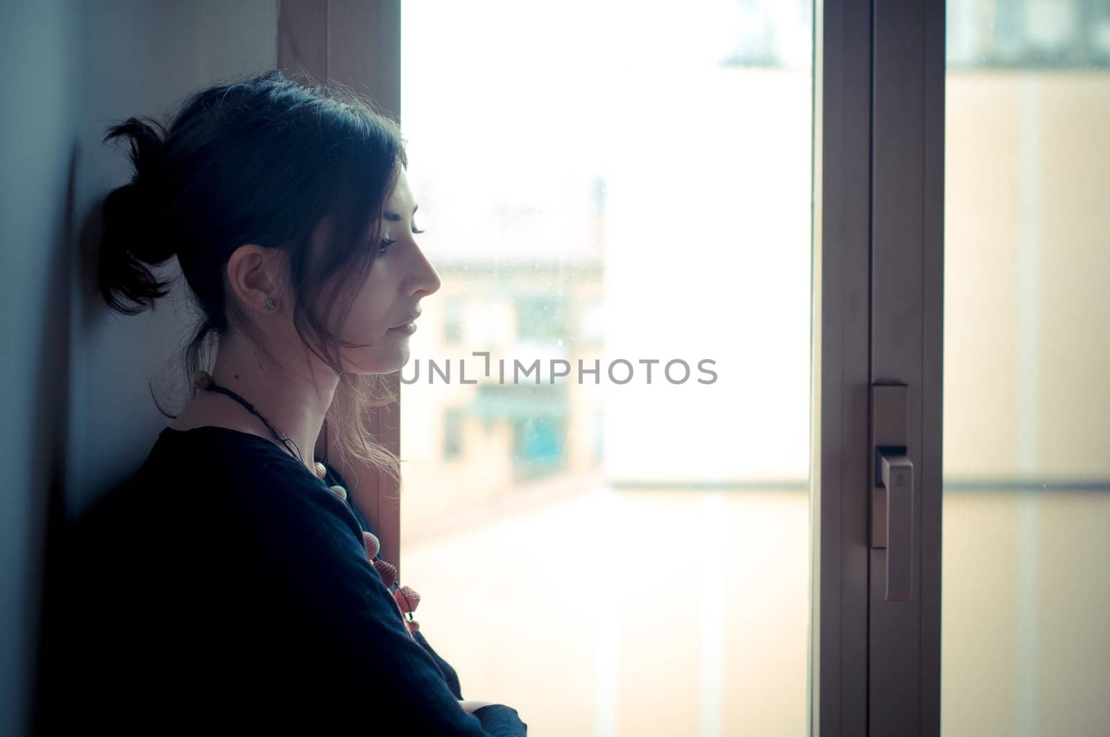 beautiful woman at home near window