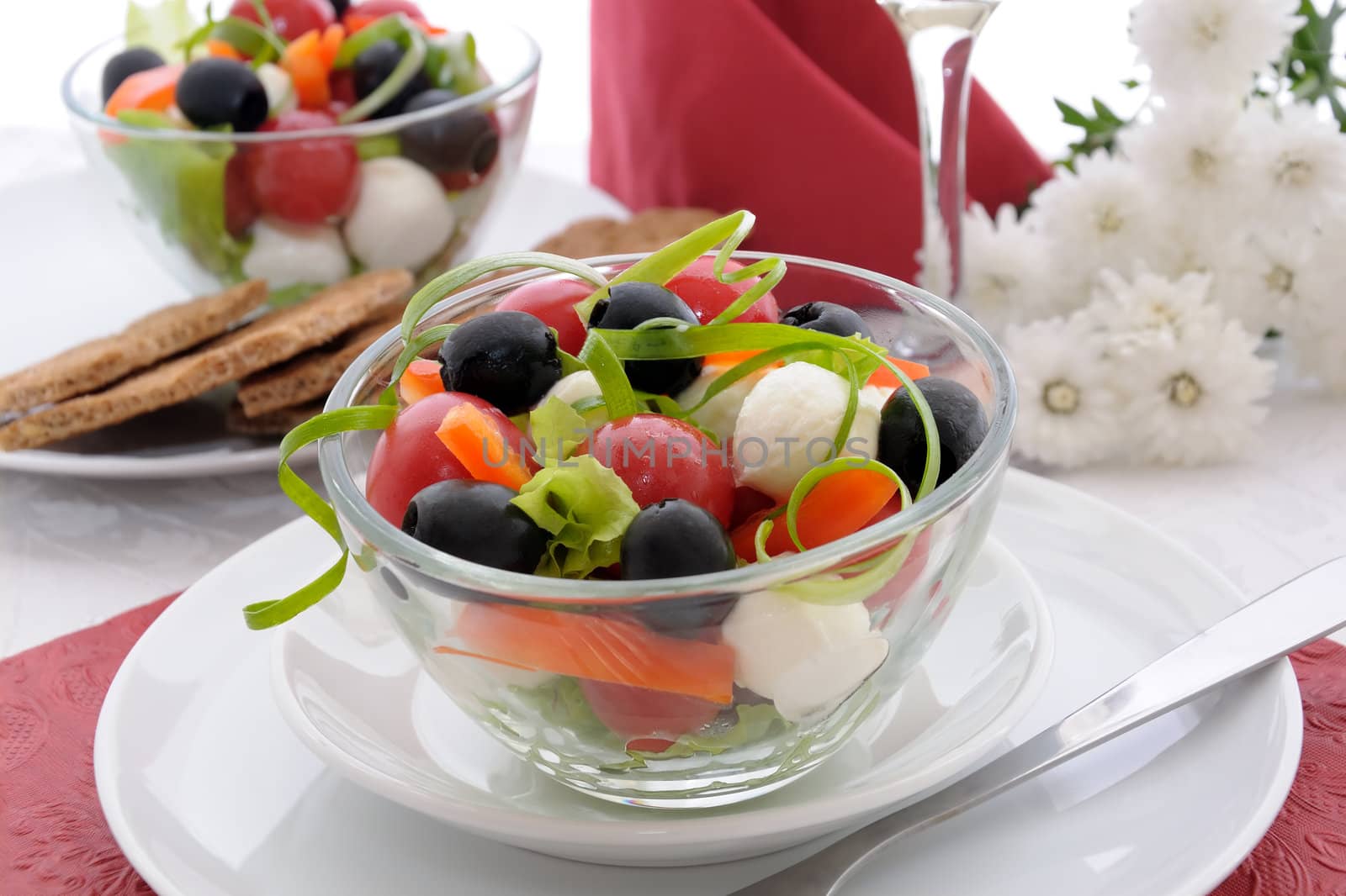 Salad of lettuce, cherry tomatoes, olives and mozzarella with pe by Apolonia