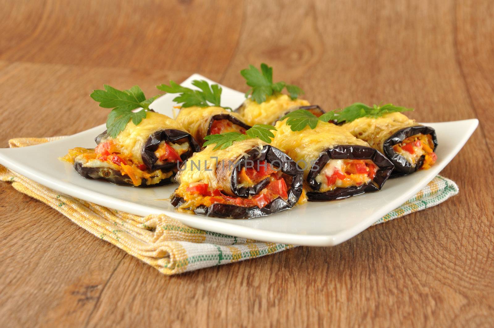 Stuffed eggplant with tomatoes, carrots and cheese