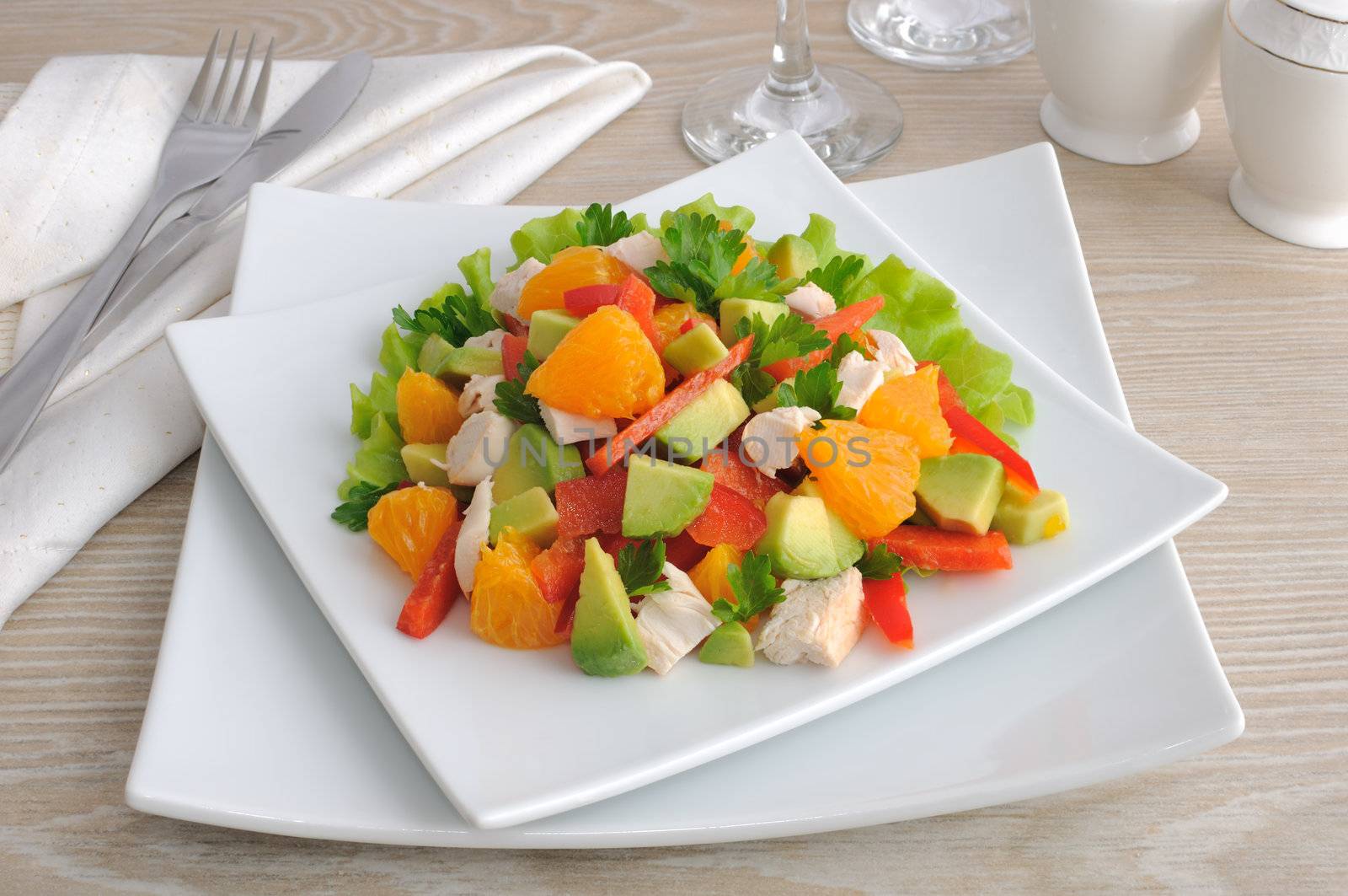 Chicken salad with avocado, sweet pepper and orange