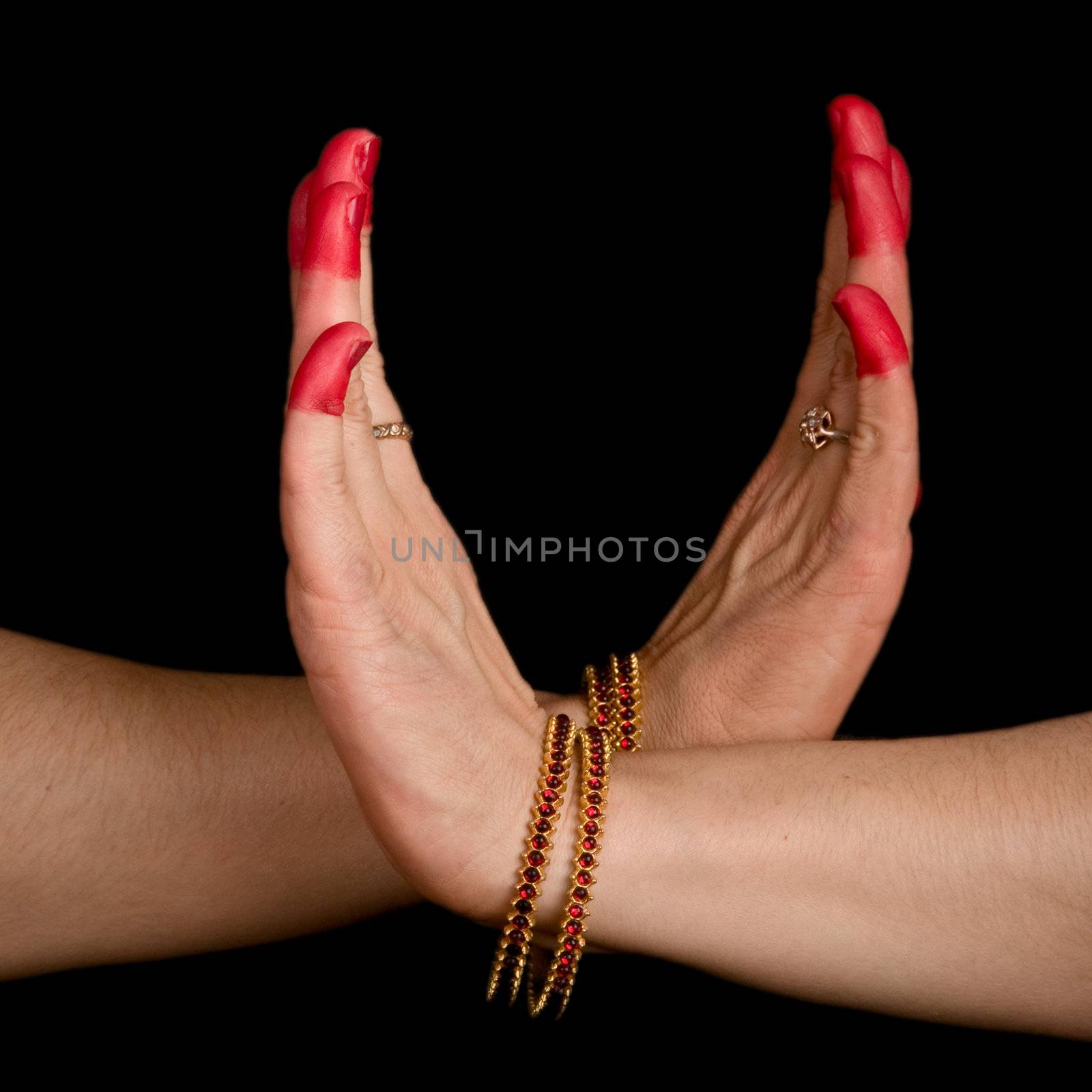 Woman hands showing Swastika hasta of indian classic dance Bharata Natyam