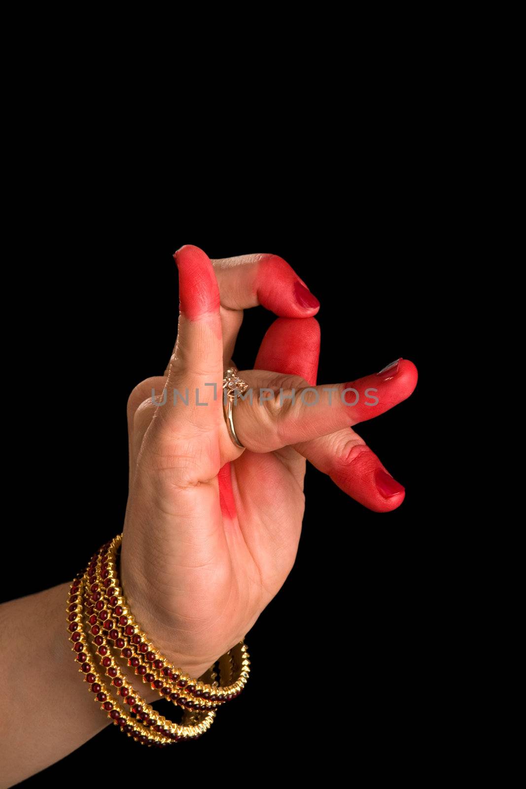 Woman hand showing Katakamukha hasta (meaning  (hand gesture, also called mudra) "Opening in a Bracelet") of indian classic dance Bharata Natyam. Also used in Indian dances Odissi and Kuchipudi.