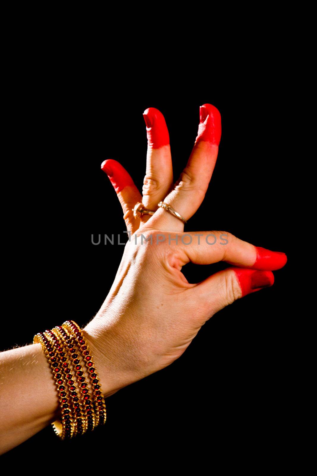 Woman hand showing Hamsasyo hasta  (hand gesture, also called mudra) (meaning "Swan beak") of indian classic dance Bharata Natyam. Also used in other indian classical dances Kuchipudi and Odissi.