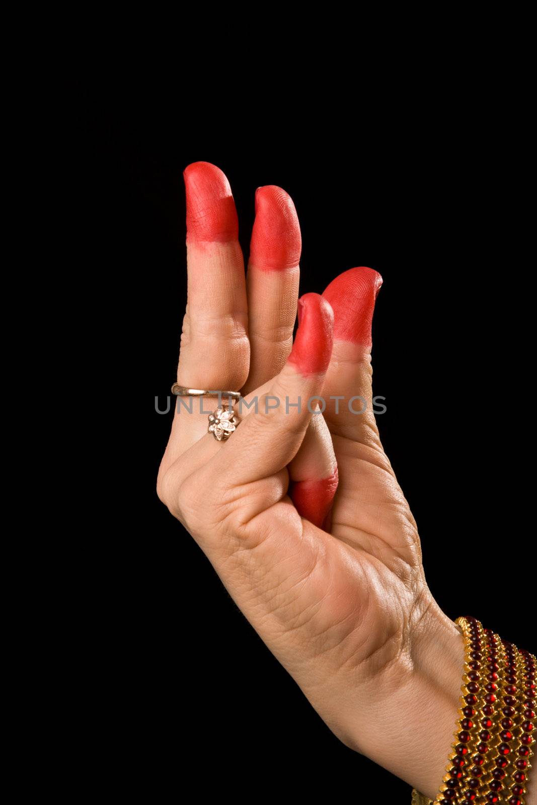 Woman hand showing Kangula hasta (hand gesture, also called mudra)  (meaning "Tail") of indian classic dance Bharata Natyam. Also used in other indian classical dances Kuchipudi and Odissi.