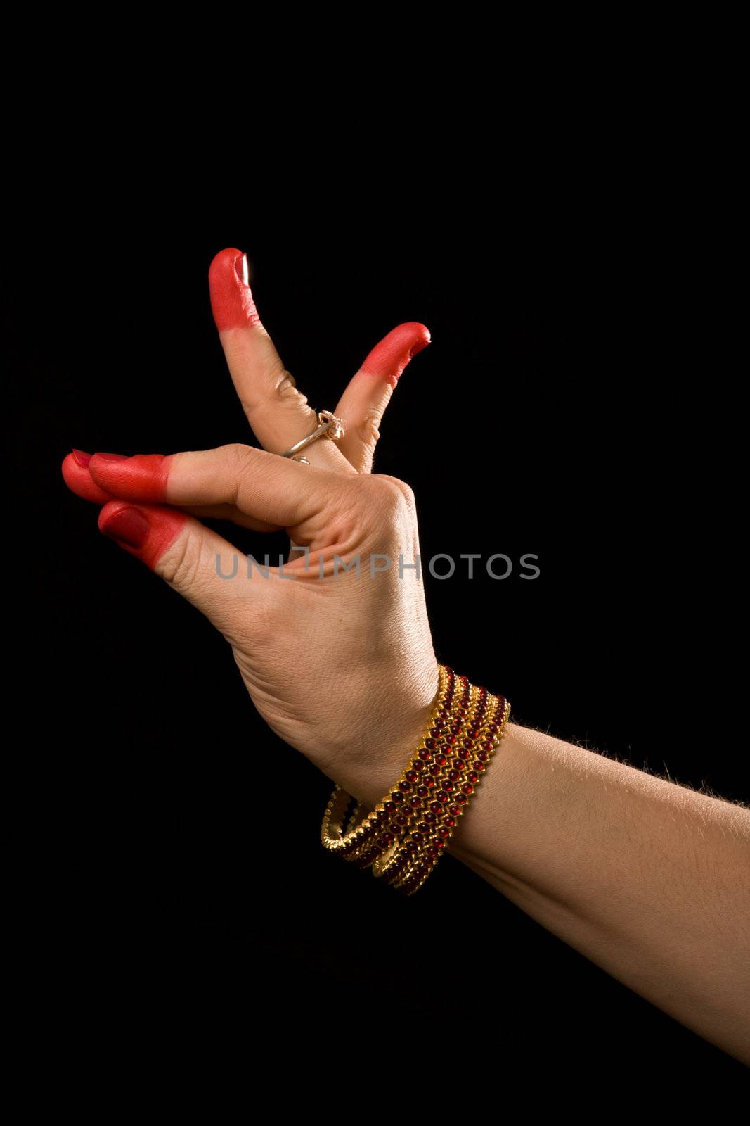 Woman hand showing Katakamukha hasta (meaning "Opening in a Bracelet") of indian classic dance Bharata Natyam