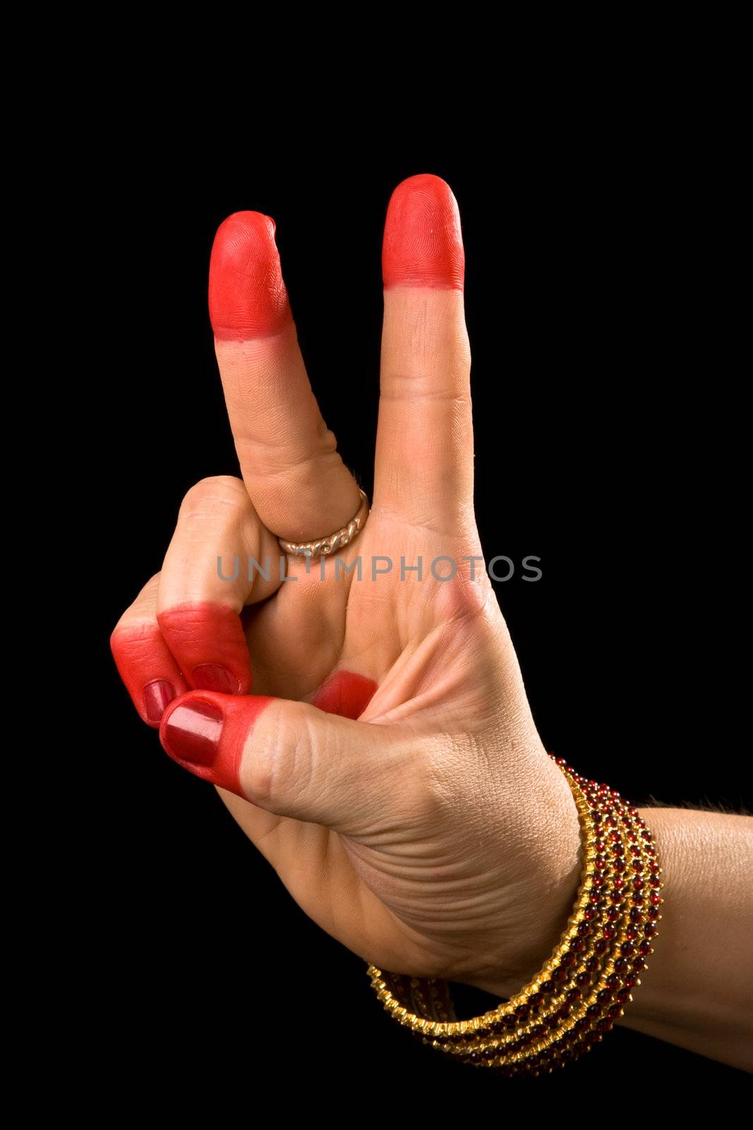 Woman hand showing Kartarimukha hasta (meaning scissors) of indian classic dance Bharata Natyam