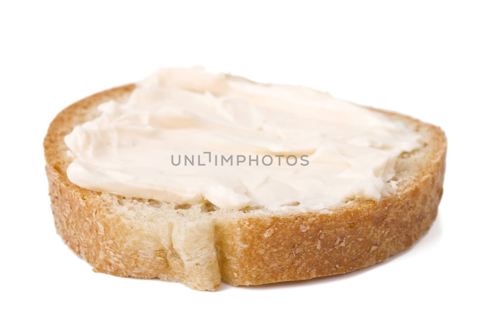 Slice of bread with cheese cream spread on it