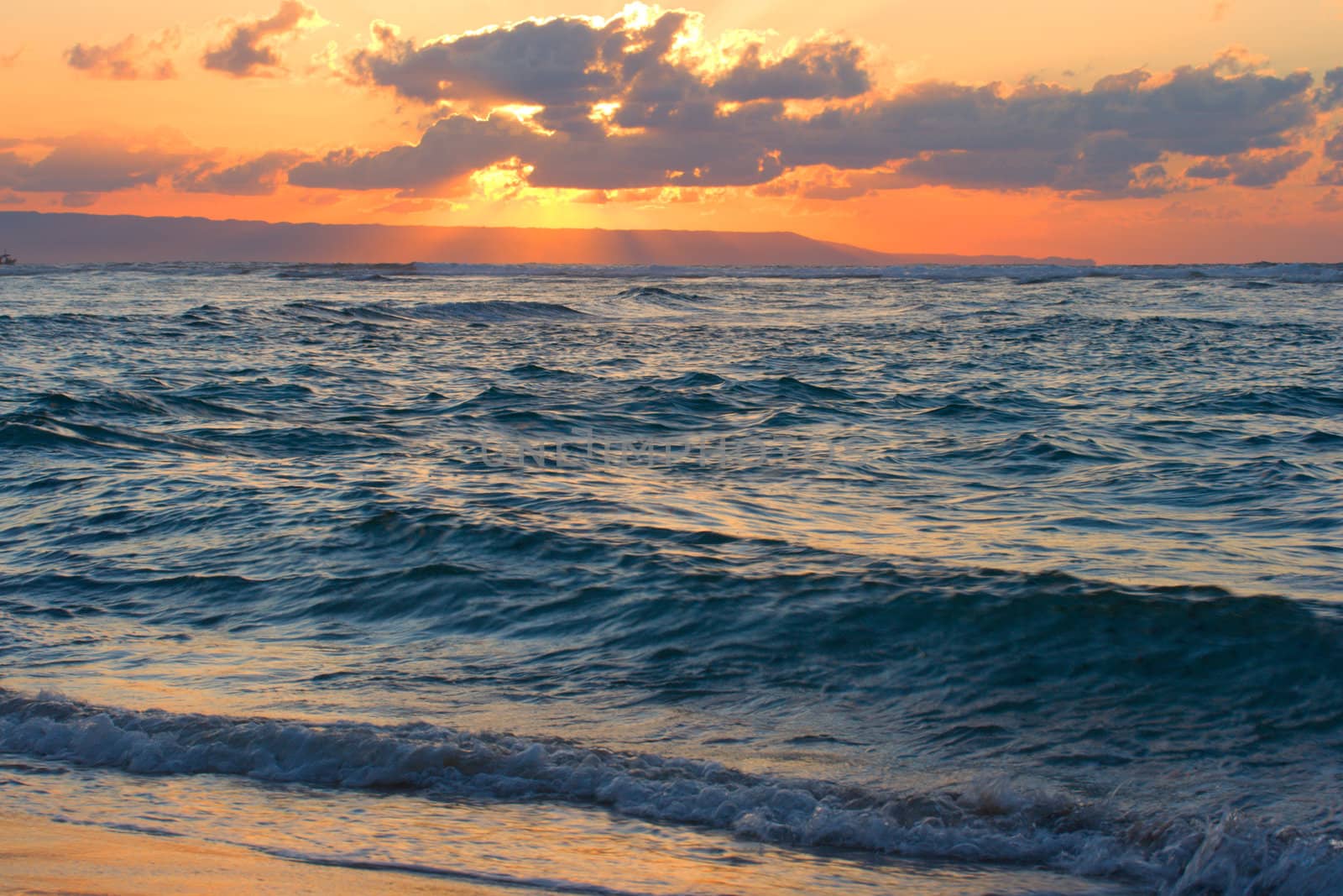 Calm peaceful ocean and beach on tropical sunrise