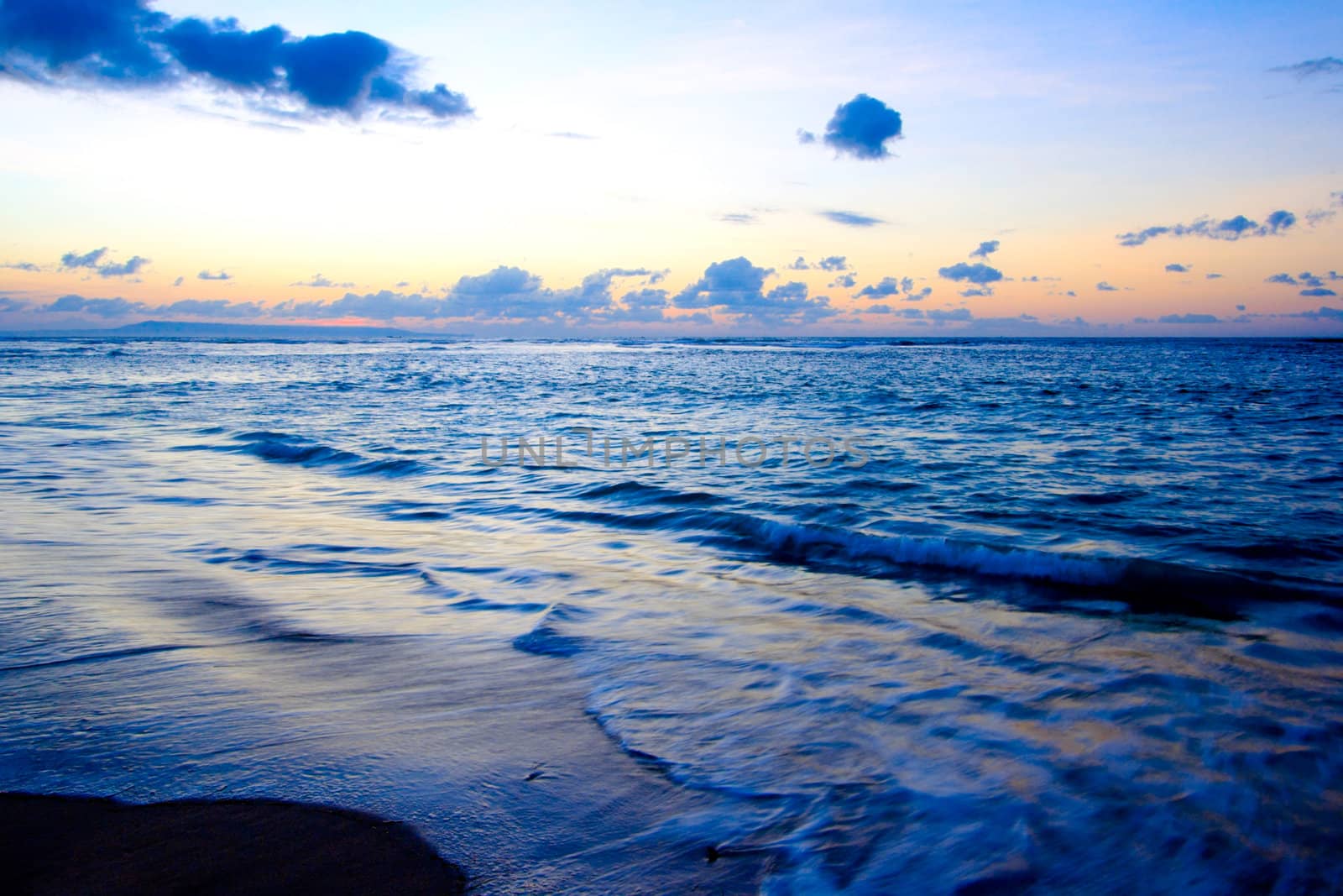 Calm ocean and beach on tropical sunrise by dimol