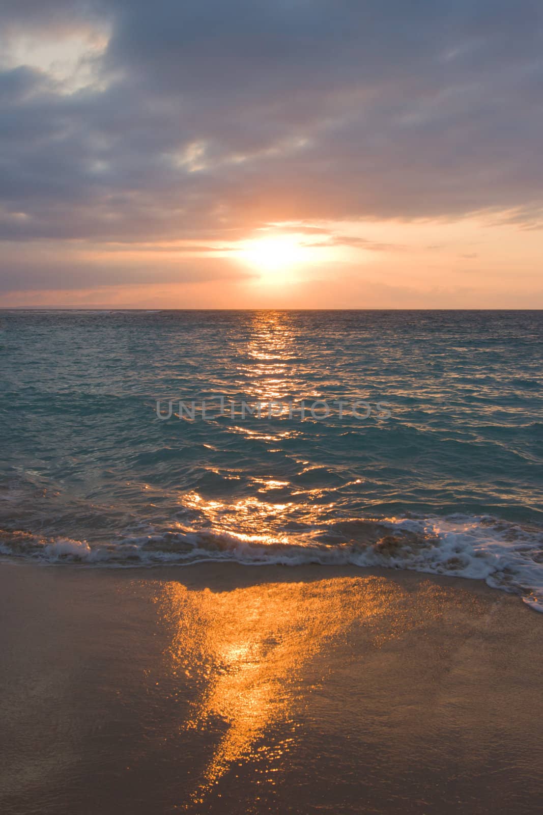Calm ocean and beach on tropical sunrise by dimol