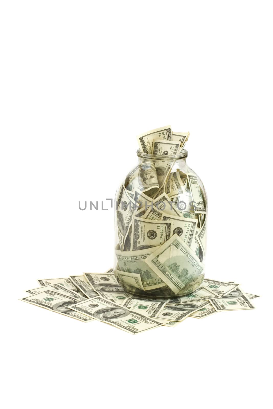 Glass jar full of  hundreds of dollars isolated on white background