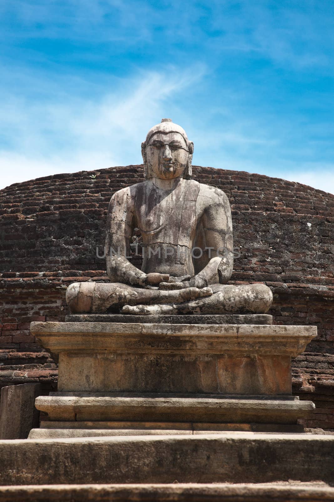 Ancient sitting Buddha image in votadage. Pollonaruwa, Sri Lanka