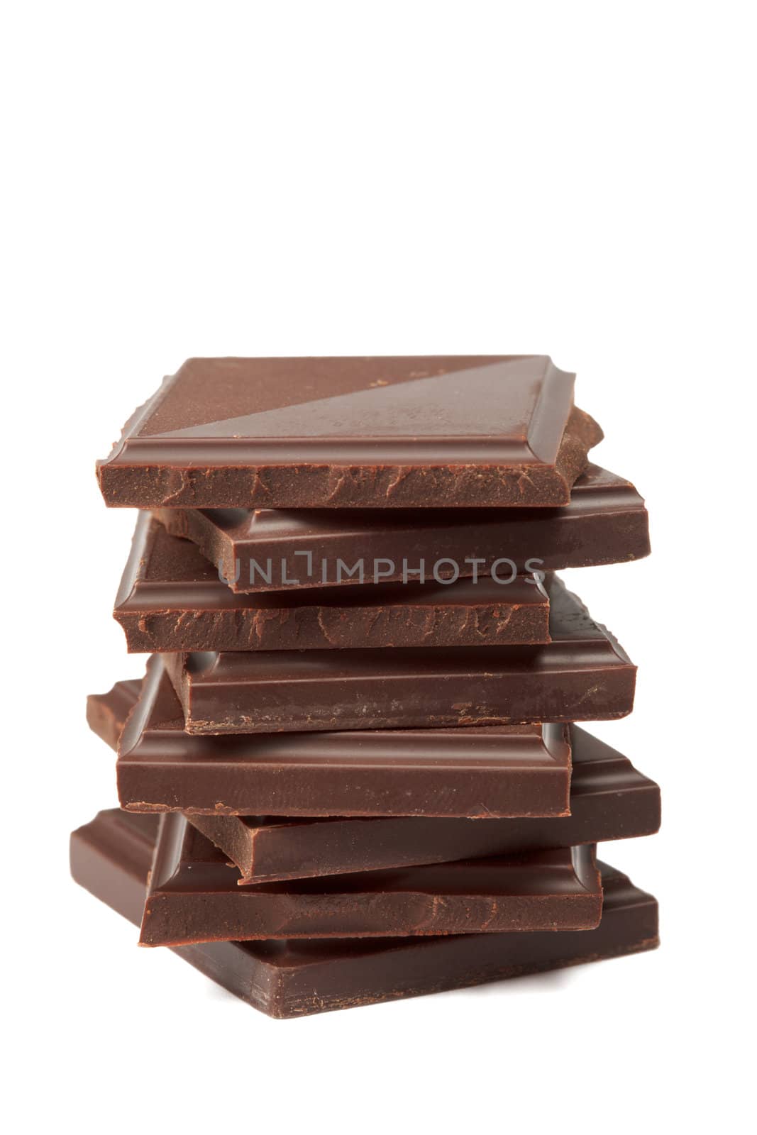 Stack of dark chocolate isolated on white