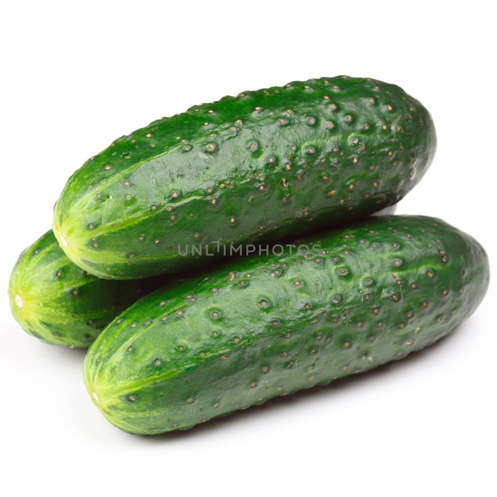 Three green cucumbers isolated on white background