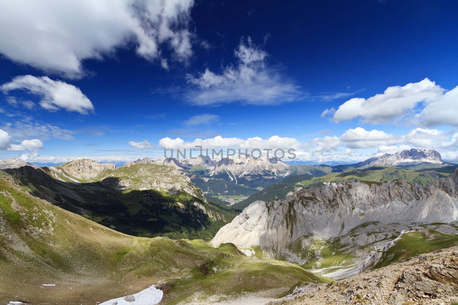 summer view of Monzoni valley with Sassolungo and Catinaccio mount on background, Italian Dolomites