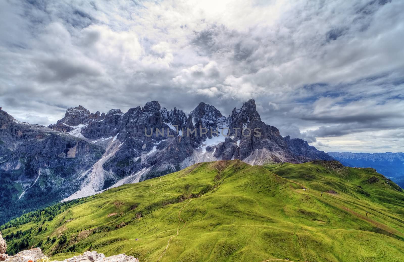 Pale San Martino against the sun from Rolle pass, Italian Dolomites - HDR image
