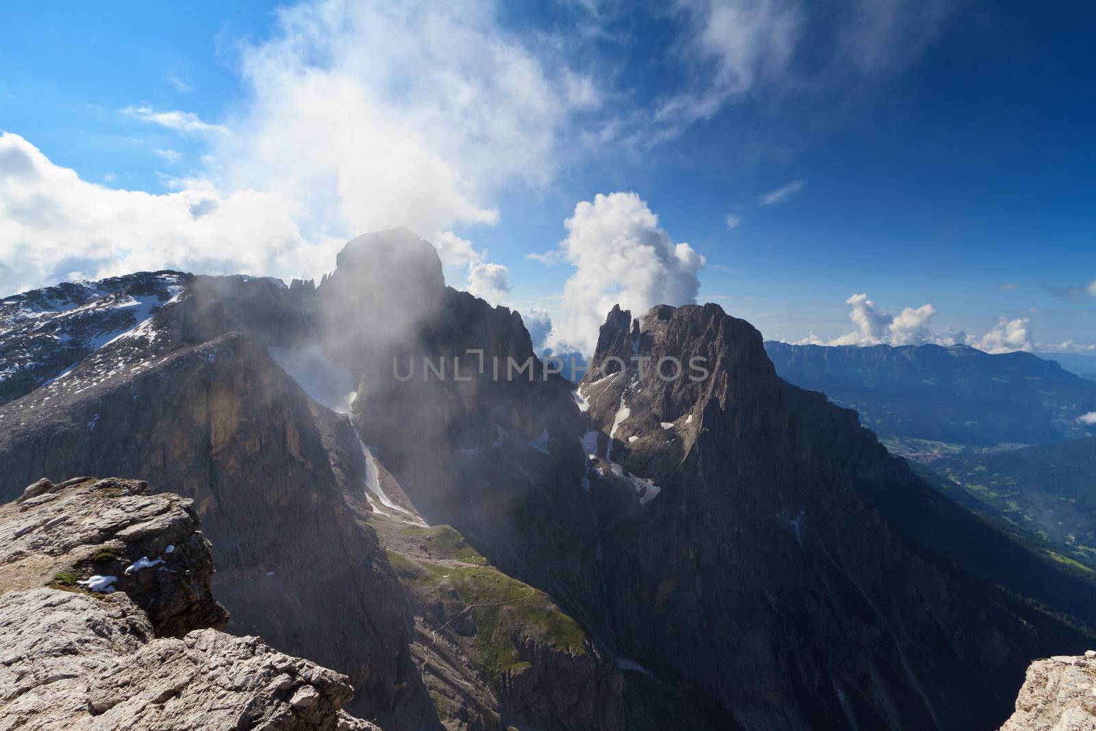 Pale di san Martino against the sun. View of Ball and Saas Maor mount from Rosetta peak, San Martino di Castrozza, Italy