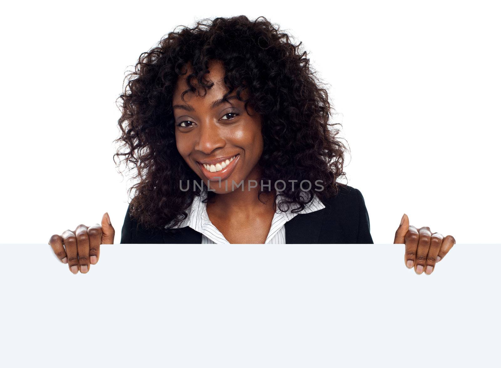 Young woman holding blank white placard by stockyimages