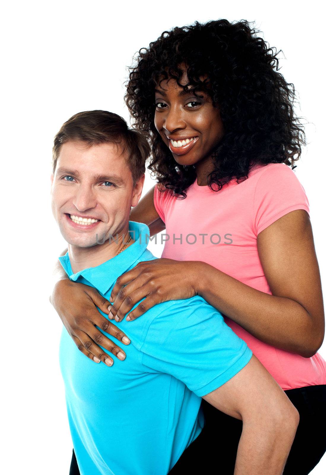 African woman enjoying piggy ride while her American boyfriend carries her