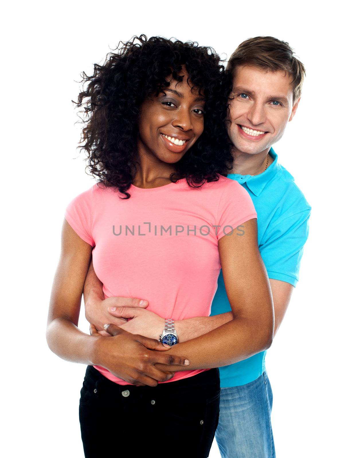 Young couple embracing and smiling by stockyimages