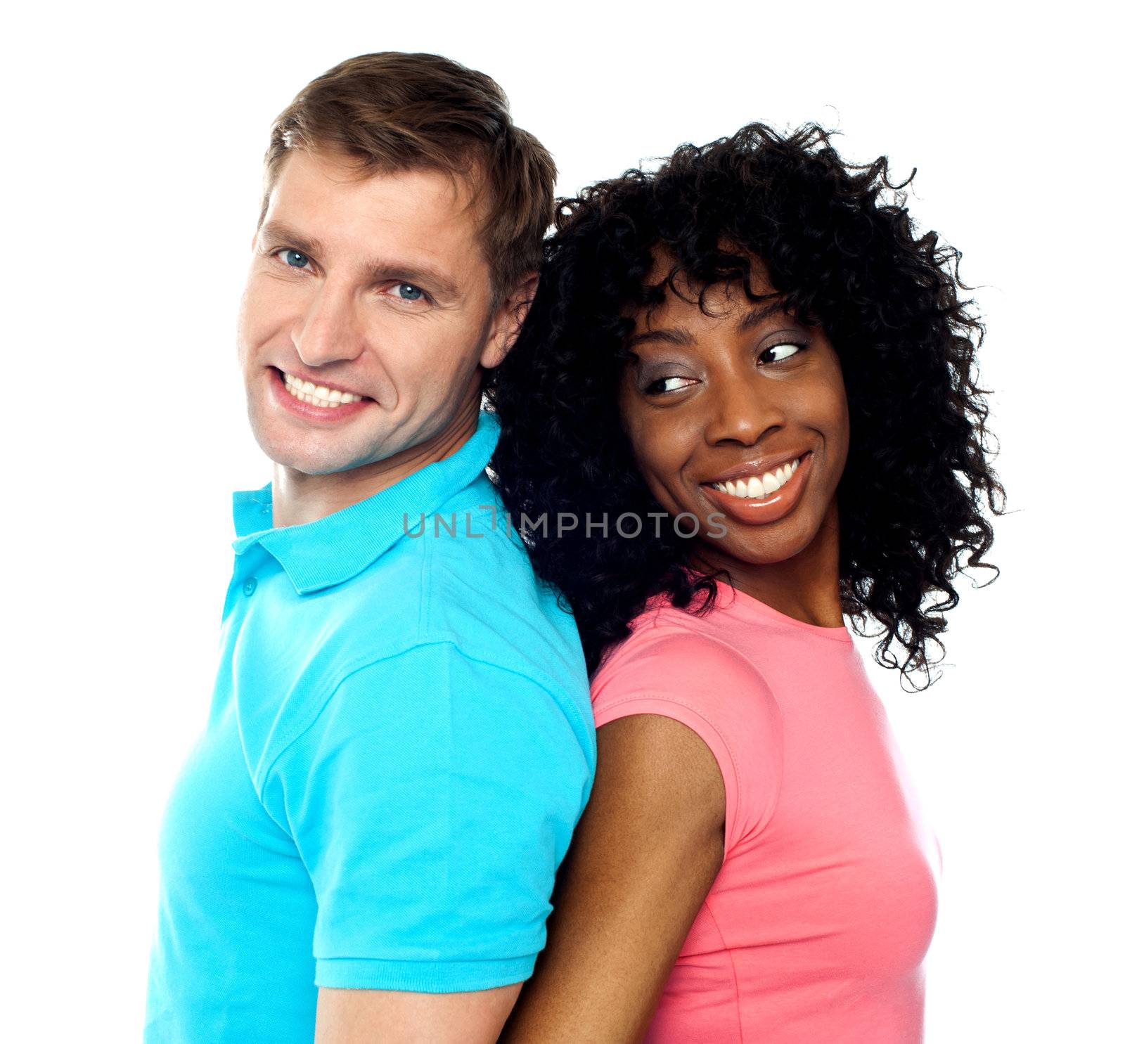 Closeup shot of young attractive couple posing back to back