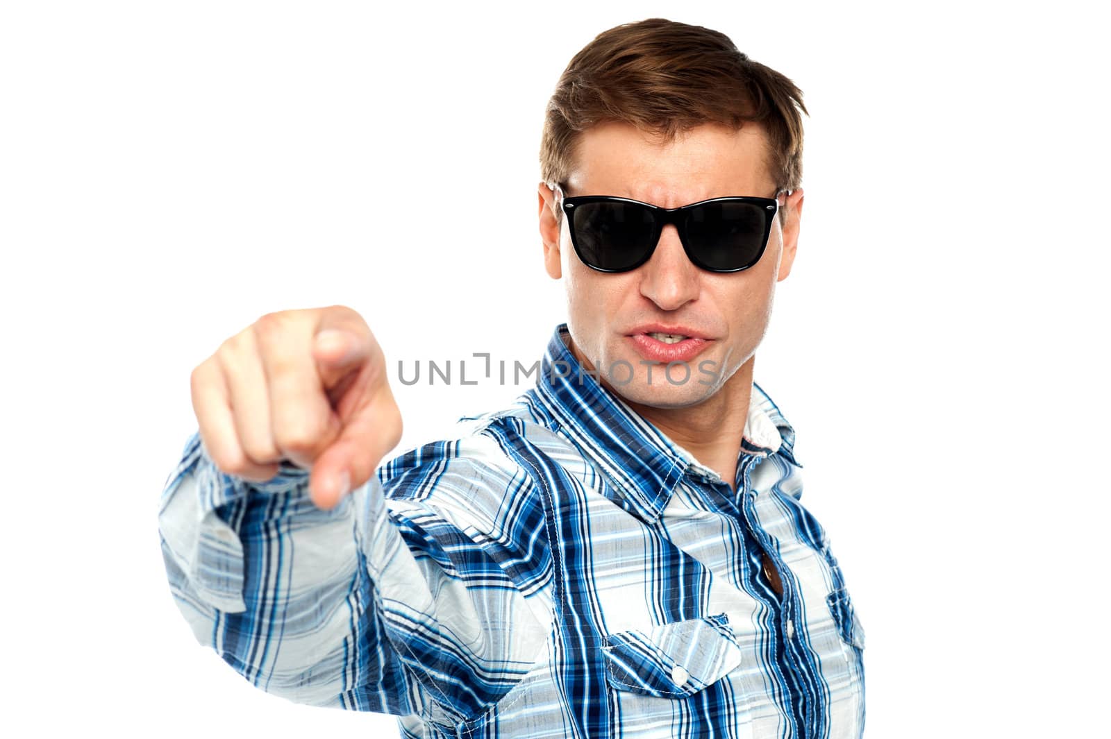 Cool fashionable guy pointing at you by stockyimages