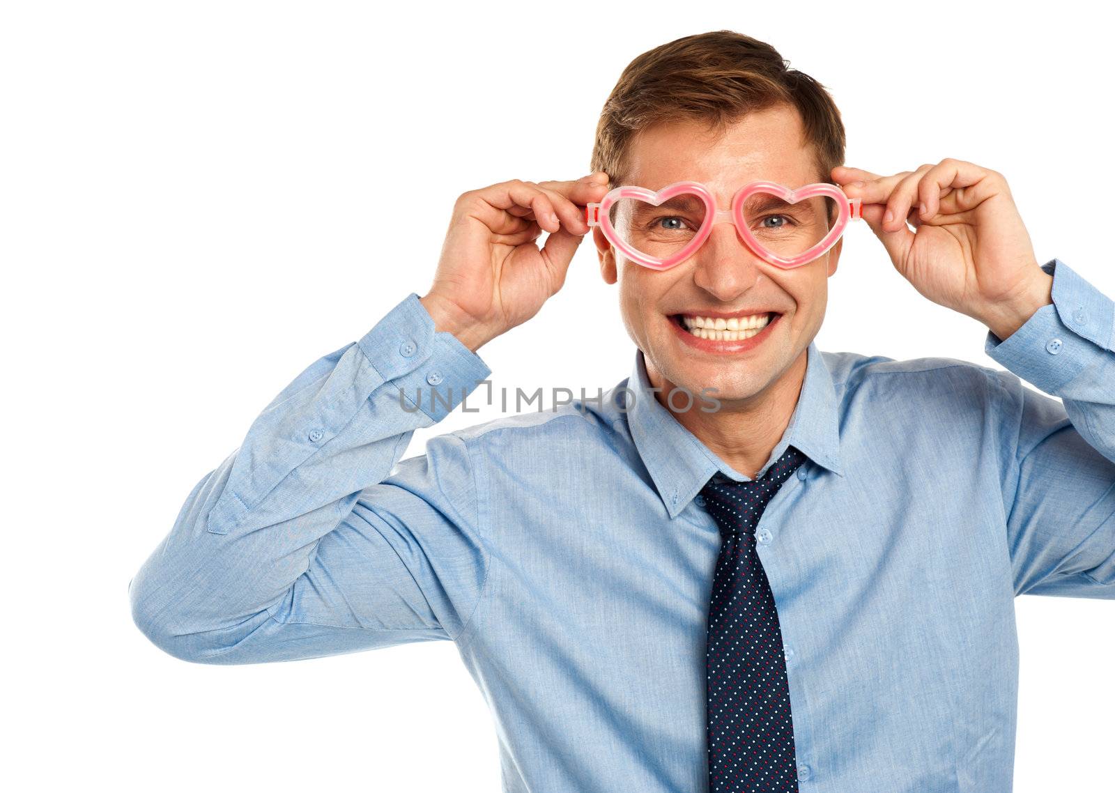 Smiling young man wearing heart shaped eye wear isolated on white