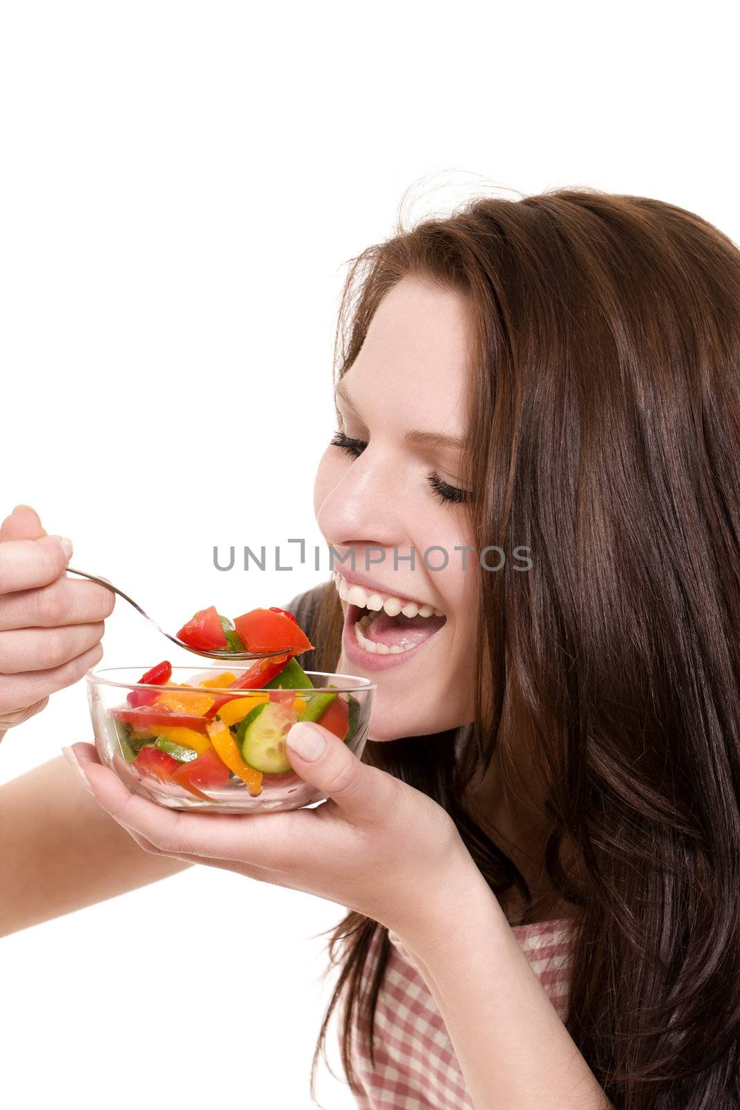 happy young woman eating salad on white background