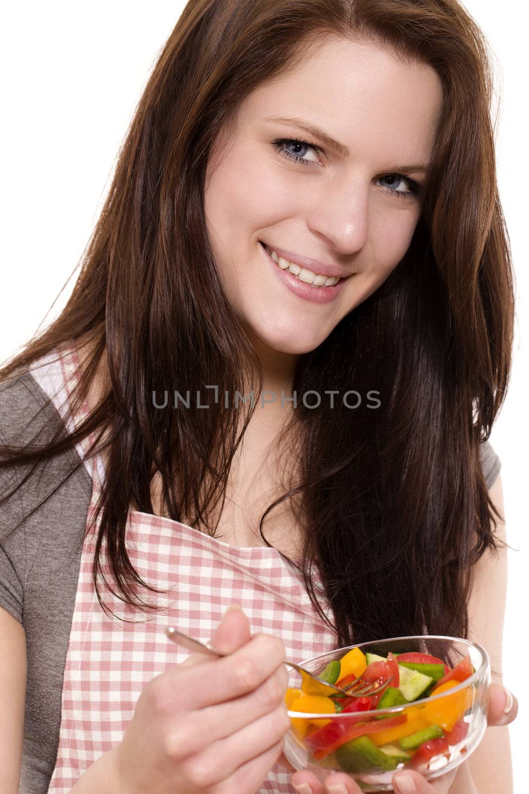 smiling young woman eating mixed salad