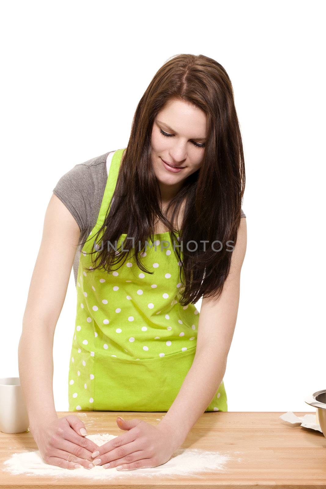 young woman forming flour for baking by RobStark