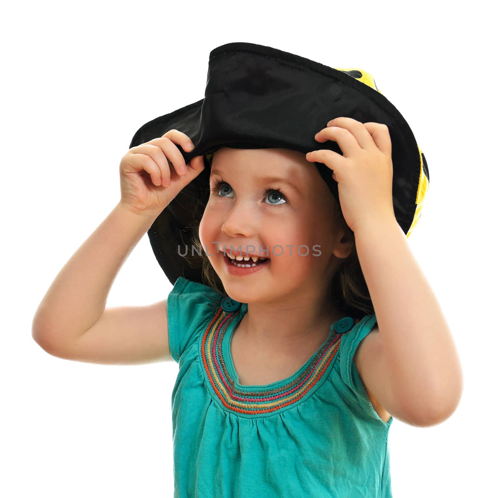 Smiling little girl in hat, isolated on white