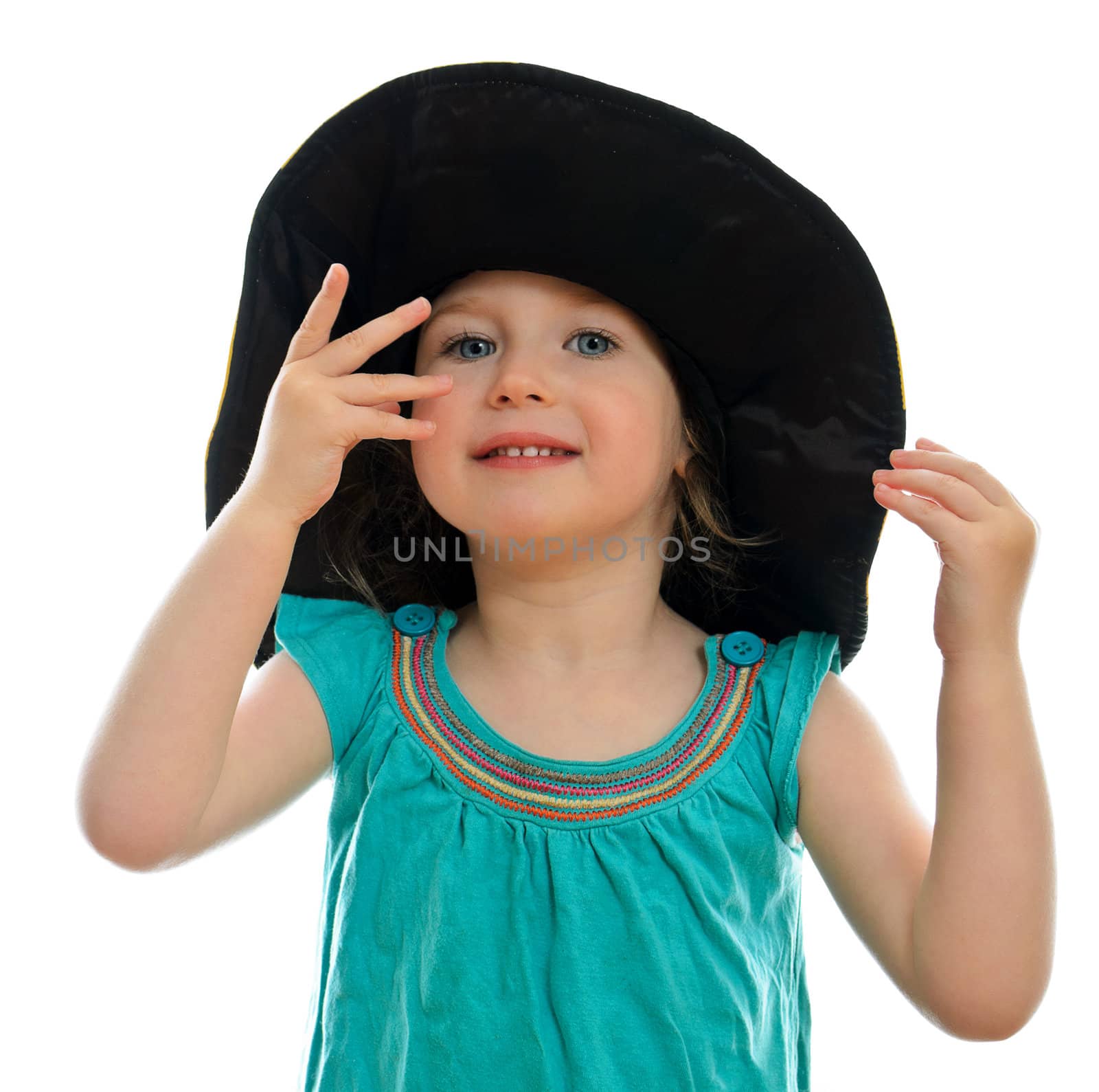 Smiling little girl in hat, isolated on white