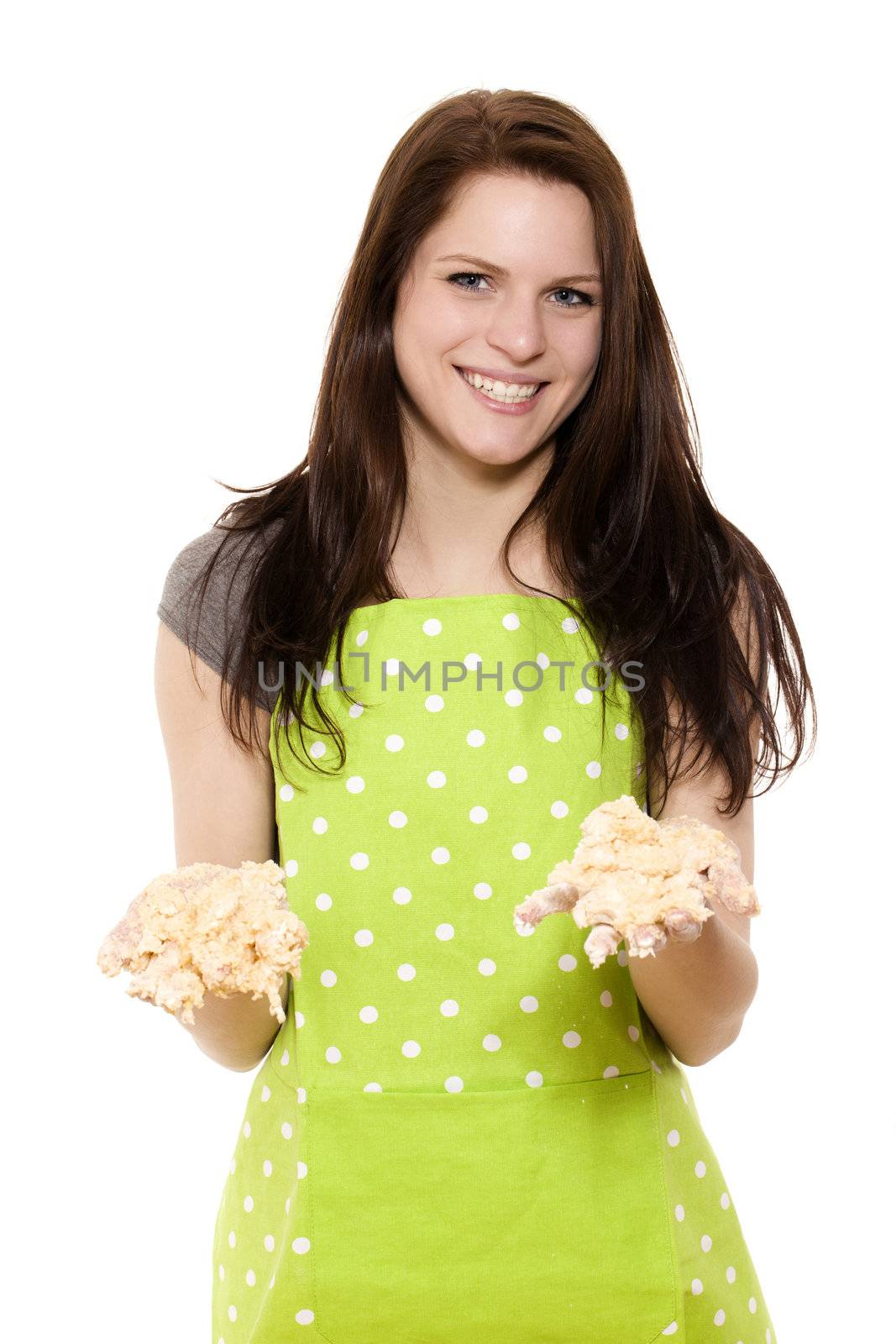 young woman holding messy dough with her handy on white background