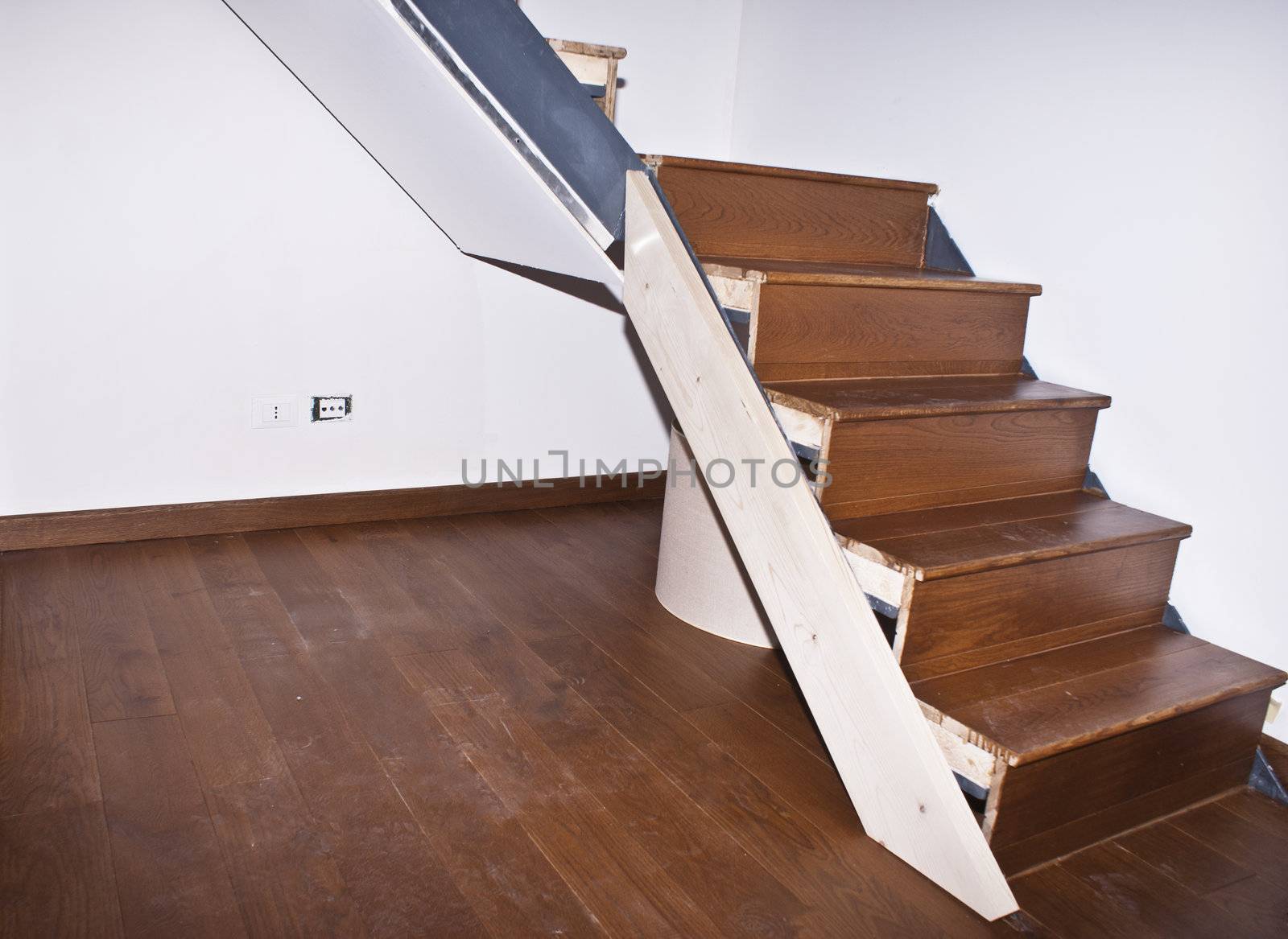 room and stair with hardwood floors 