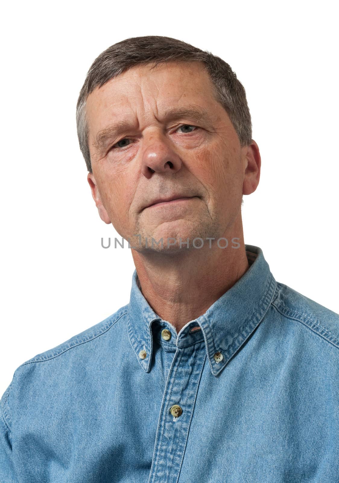 Retired executive looks pensively towards the camera and isolated against white