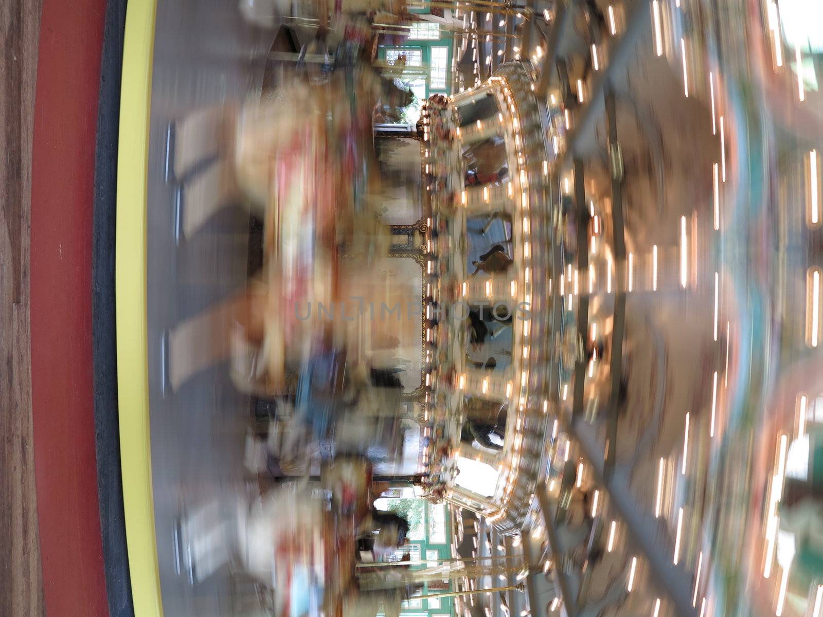 Antique carousel with carved horses at Glen Echo National Park in Maryland with motion blur