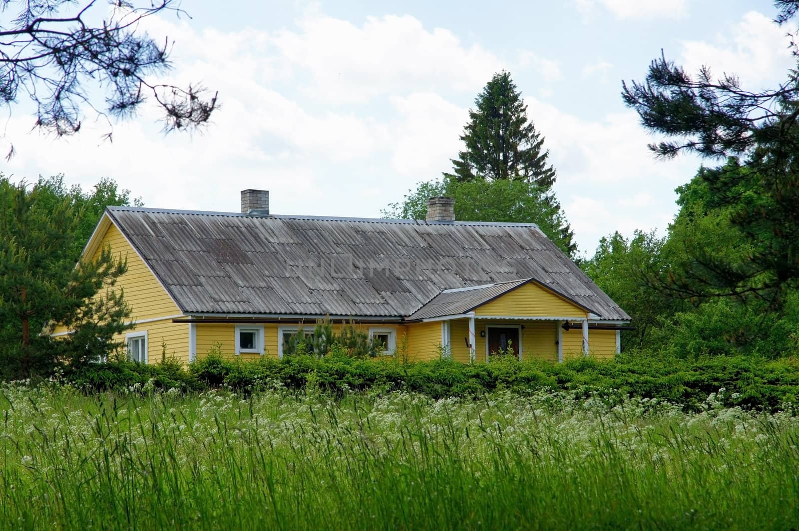 The wooden house on a background of the  sky