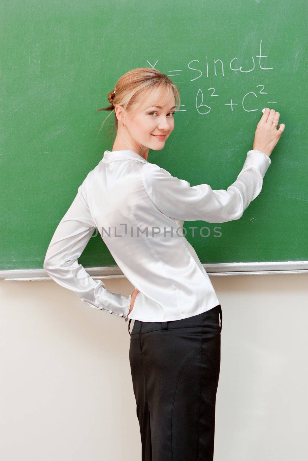 teacher writes on blackboard by nigerfoxy