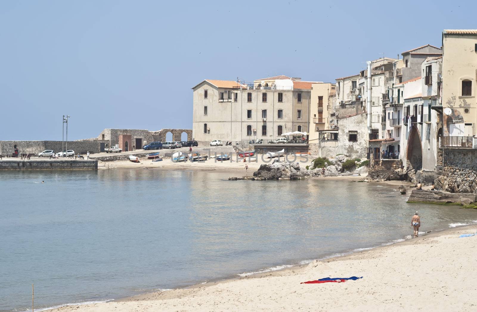 Cefalu Beach with old buildings and clear  blue sky. Sicily 