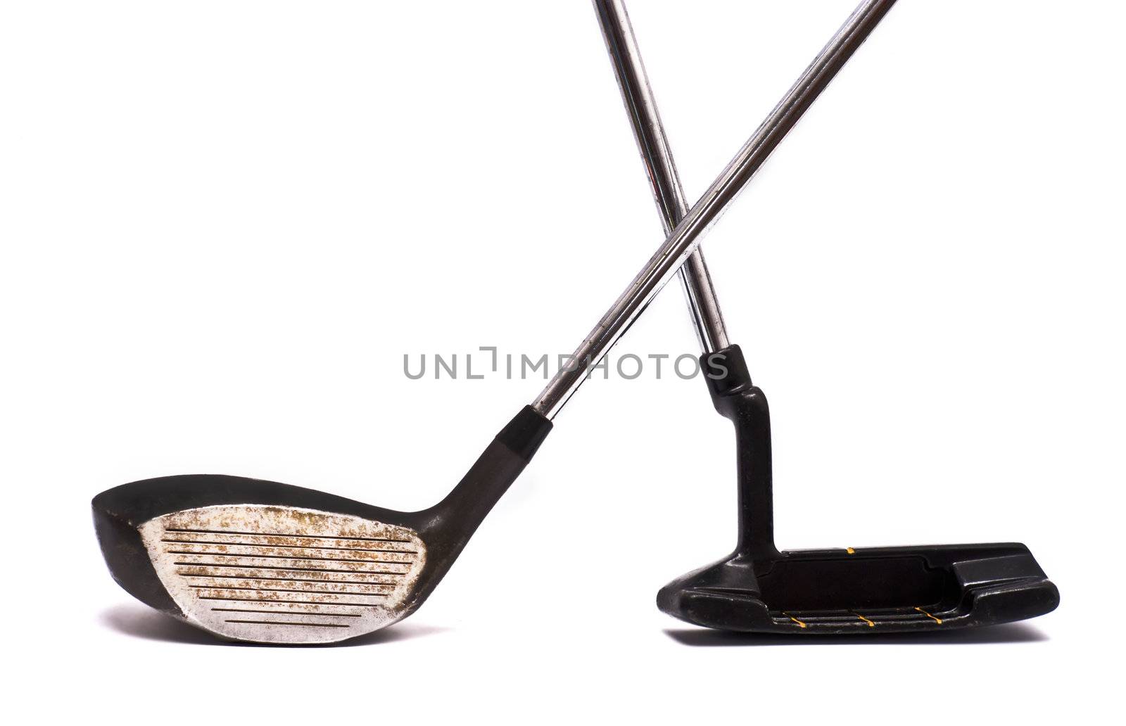 Vintage golf clubs on white.