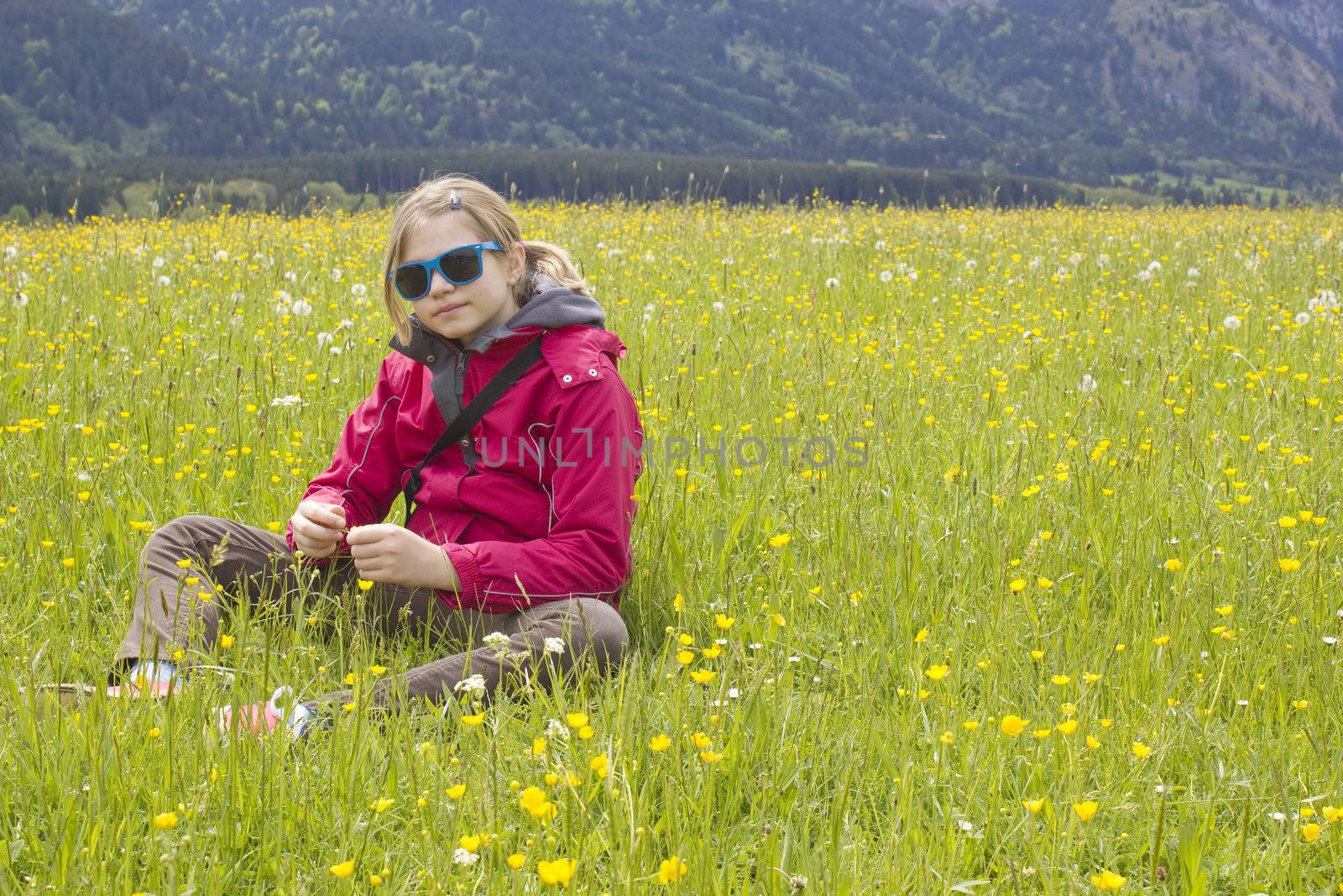 little girl in a meadow by miradrozdowski