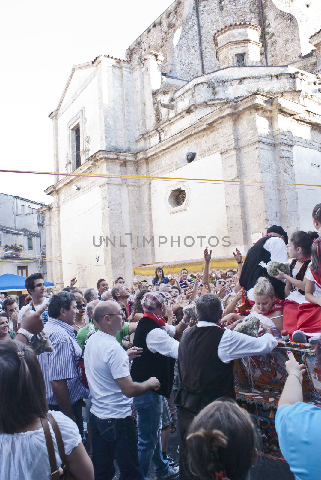 POLIZZI GENEROSA, SICILY - AUGUST 21: Sicilian cart delivers the nuts to tourists at the International "Festival of hazelnuts",parade through the city: August 21, 2011 in Polizzi Generosa,Sicily,Italy