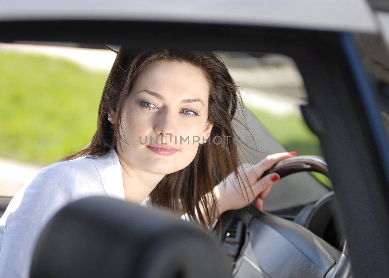 portrait of beautiful woman in the premium car
