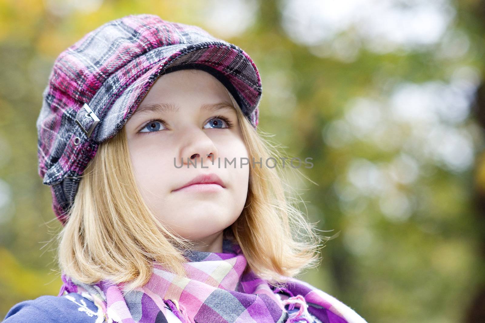 Autumn portrait of a lovely little girl
