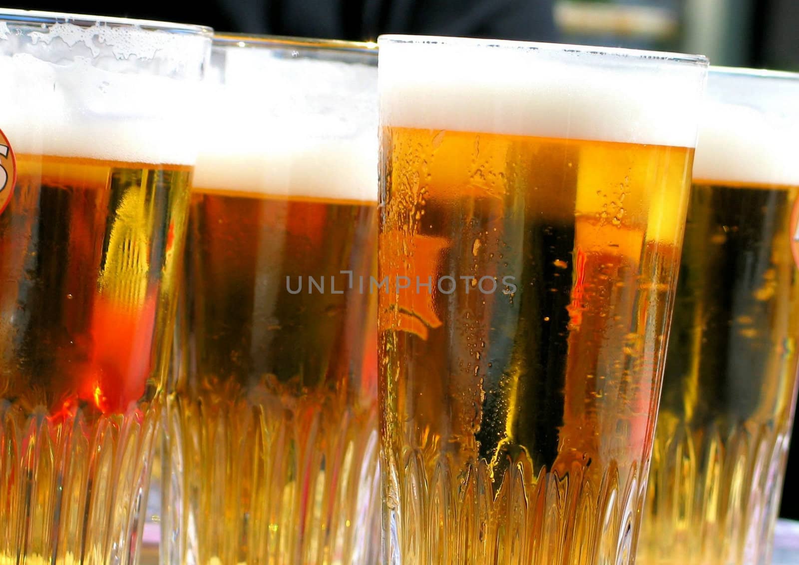 Glasses of beer close-up by Baltus