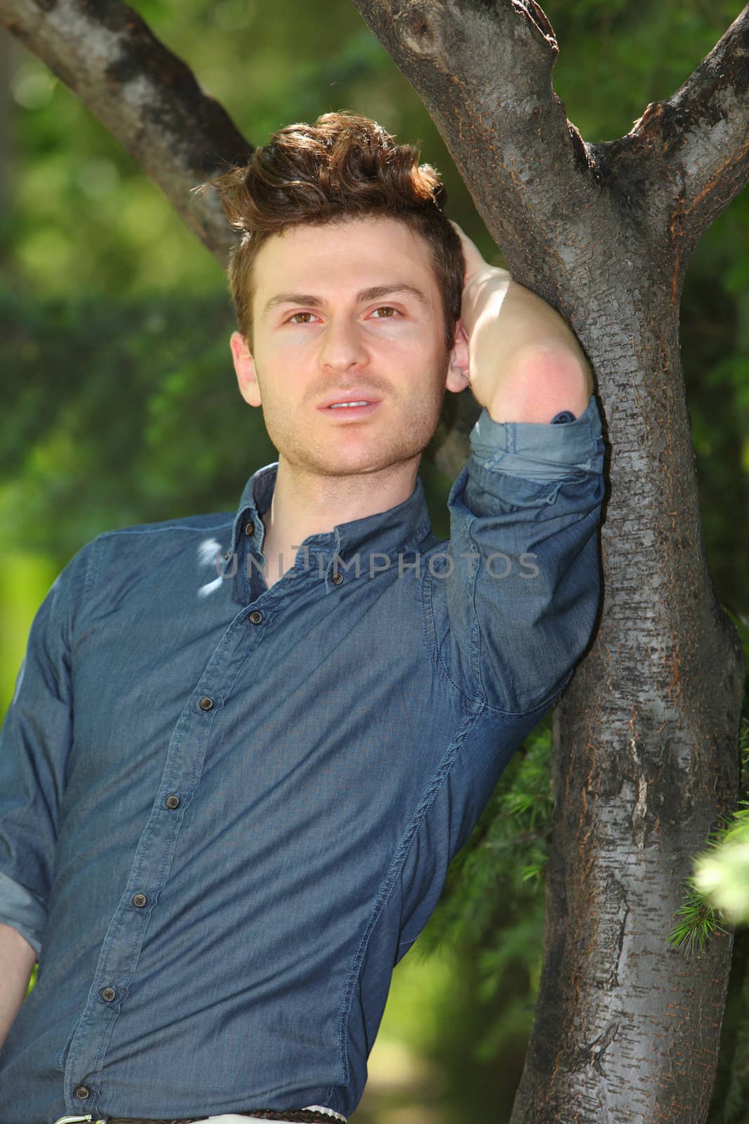 Portrait of handsome man in park