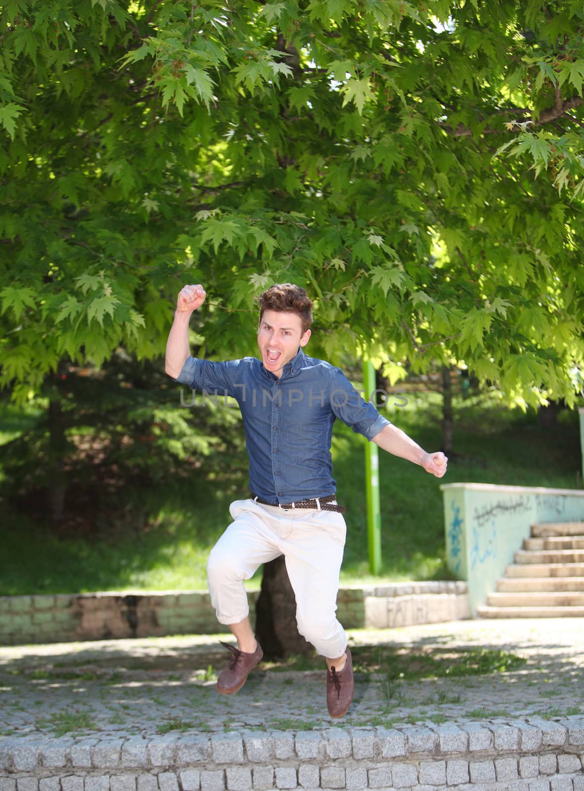 Jumping and happy red hair russian man