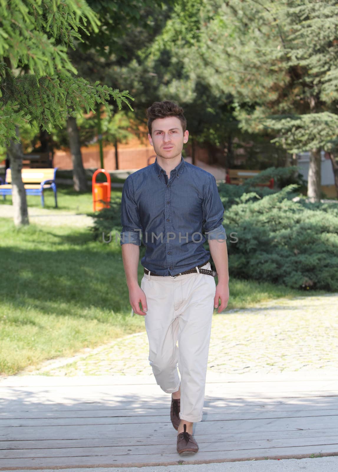 Young man walking in park