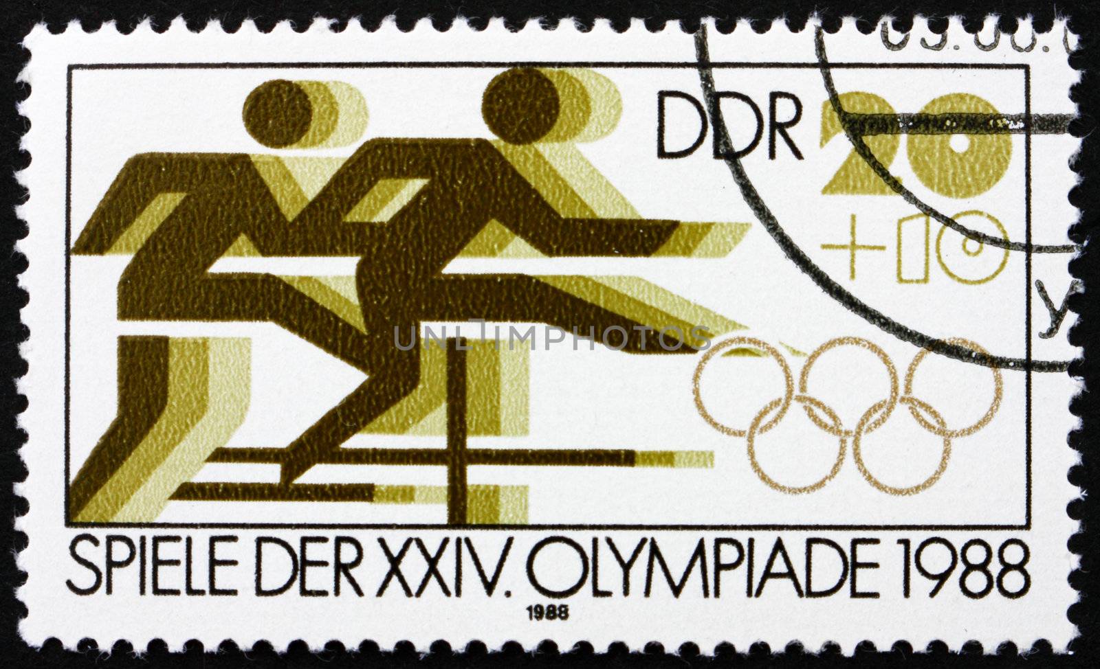 GDR - CIRCA 1988: a stamp printed in GDR shows Hurdle Race, 24th Summer Olympics, Seoul, South Korea, circa 1988
